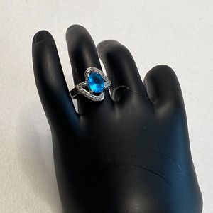 Silver Plated Ring Aqua Blue Oval Stone Surrounded By Clear Rhinestones